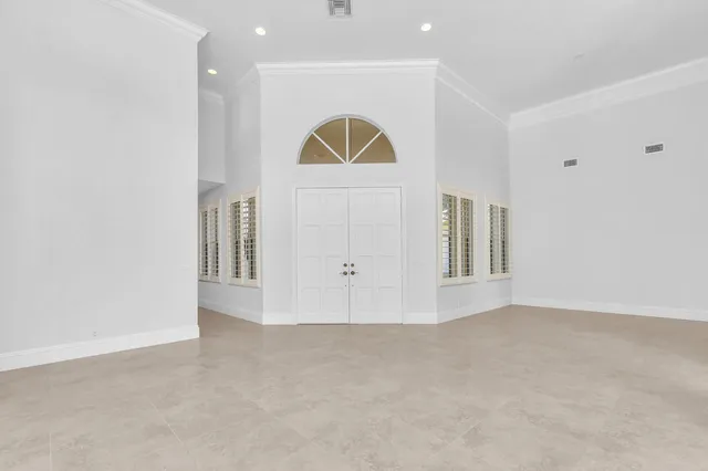 a kitchen with stainless steel appliances kitchen island granite countertop a table and chairs in it