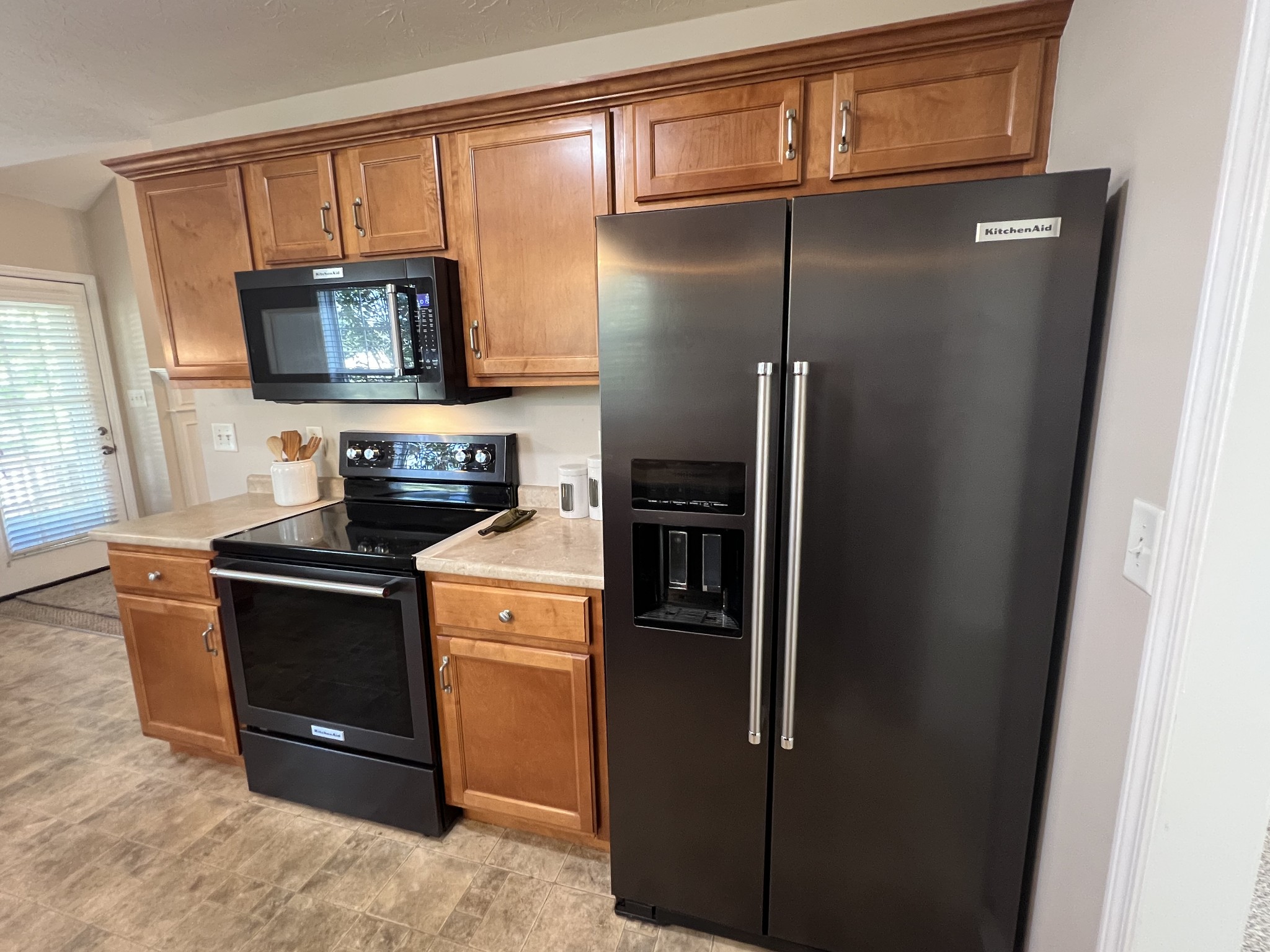364 Dixie Lane Pleasant View, TN 37146 - Photo 19 of 45 a kitchen with stainless steel appliances granite countertop a refrigerator and a stove top oven