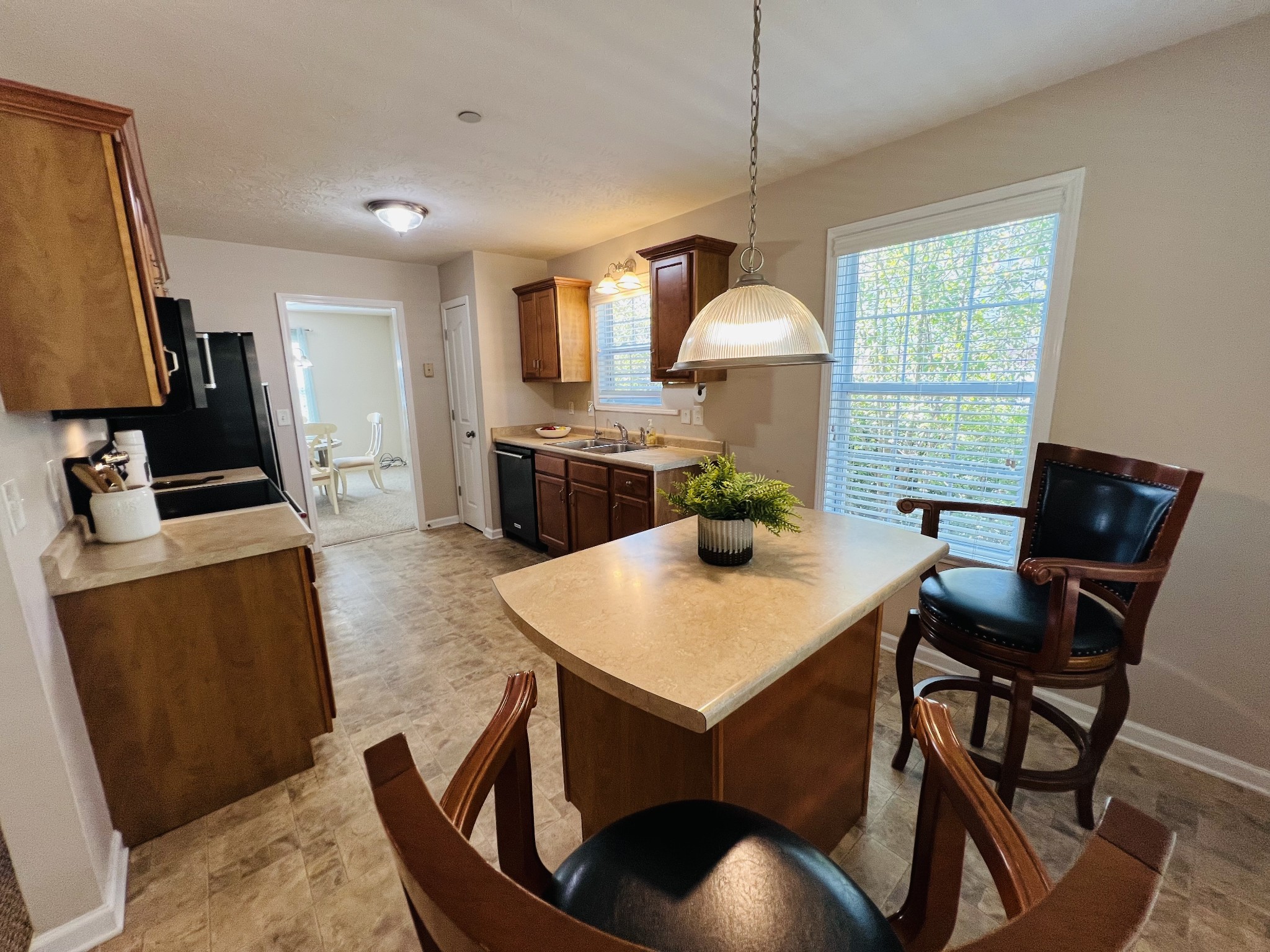 364 Dixie Lane Pleasant View, TN 37146 - Photo 22 of 45 a view of kitchen with cabinets dining table and chairs