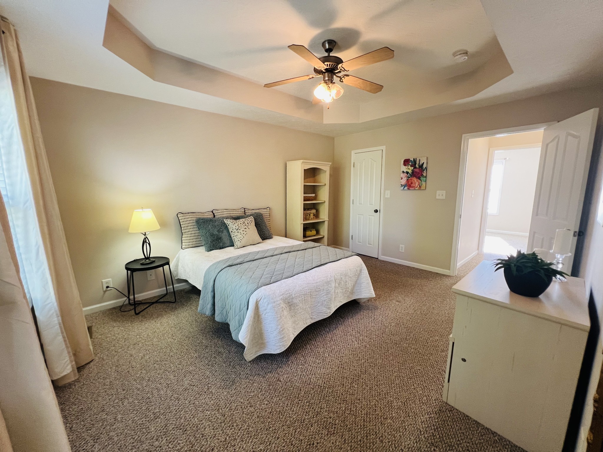 364 Dixie Lane Pleasant View, TN 37146 - Photo 26 of 45 a spacious bedroom with a bed and a chandelier