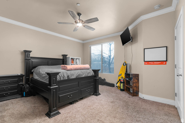 476 West 200 N Street, Unit 206 Springville, UT 84663 - Photo 9 of 24 Bedroom with ornamental molding, light carpet, and a ceiling fan