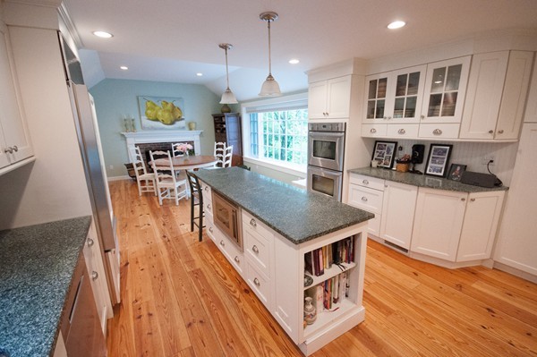 3 Decatur Lane Wayland, MA 01778 - Photo 3 of 15 an open kitchen with kitchen island wooden floor center island and stainless steel appliances