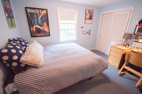 3 Decatur Lane Wayland, MA 01778 - Photo 10 of 15 a bedroom with a bed and wooden floor