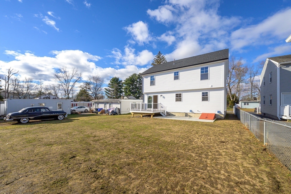 39 Wallace Street Springfield, MA 01119 - Photo 41 of 41 a big white house with a big yard and large trees