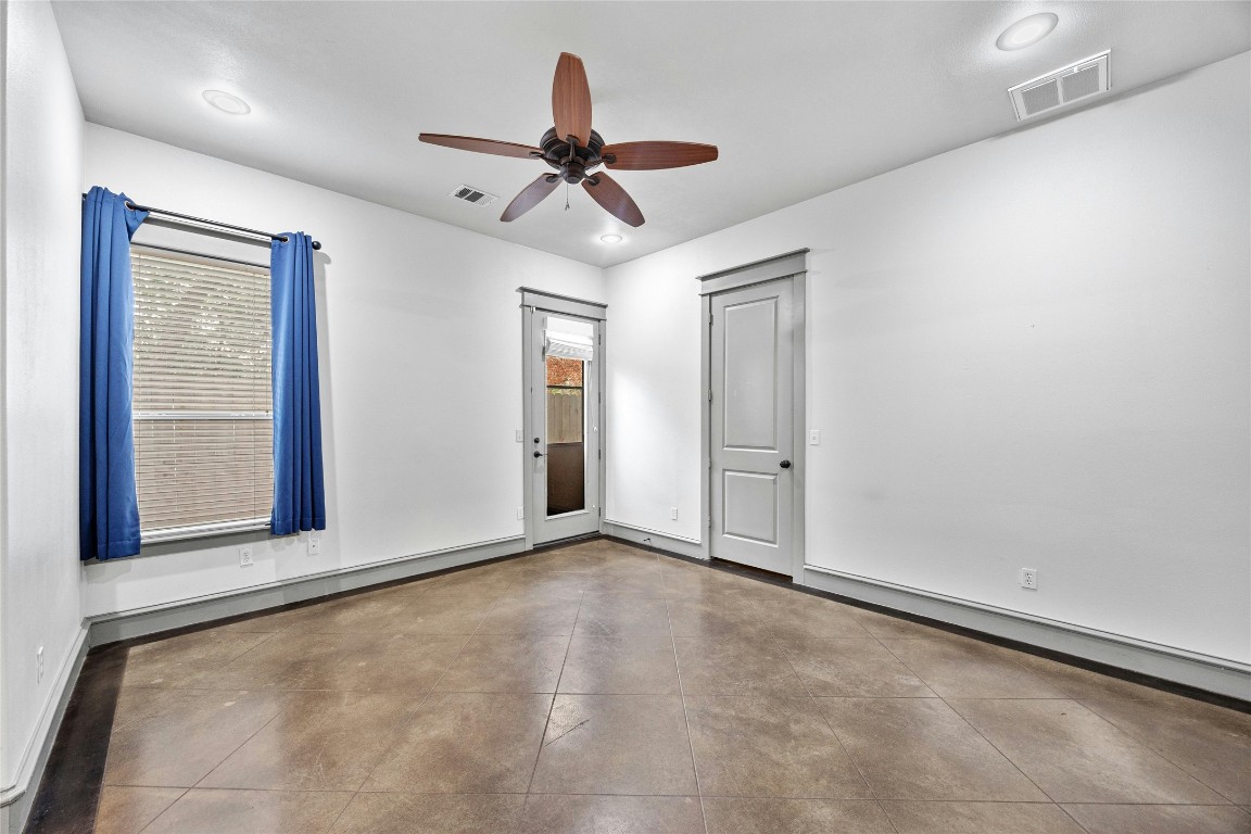5617 Clay Avenue, Unit B Austin, TX 78756 - Photo 15 of 38 an empty room with ceiling fan and windows