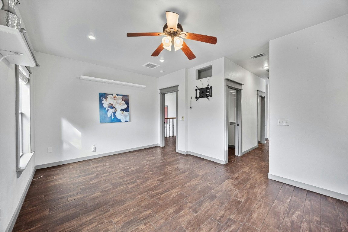 5617 Clay Avenue, Unit B Austin, TX 78756 - Photo 23 of 38 a view of a livingroom with wooden floor ceiling fan
