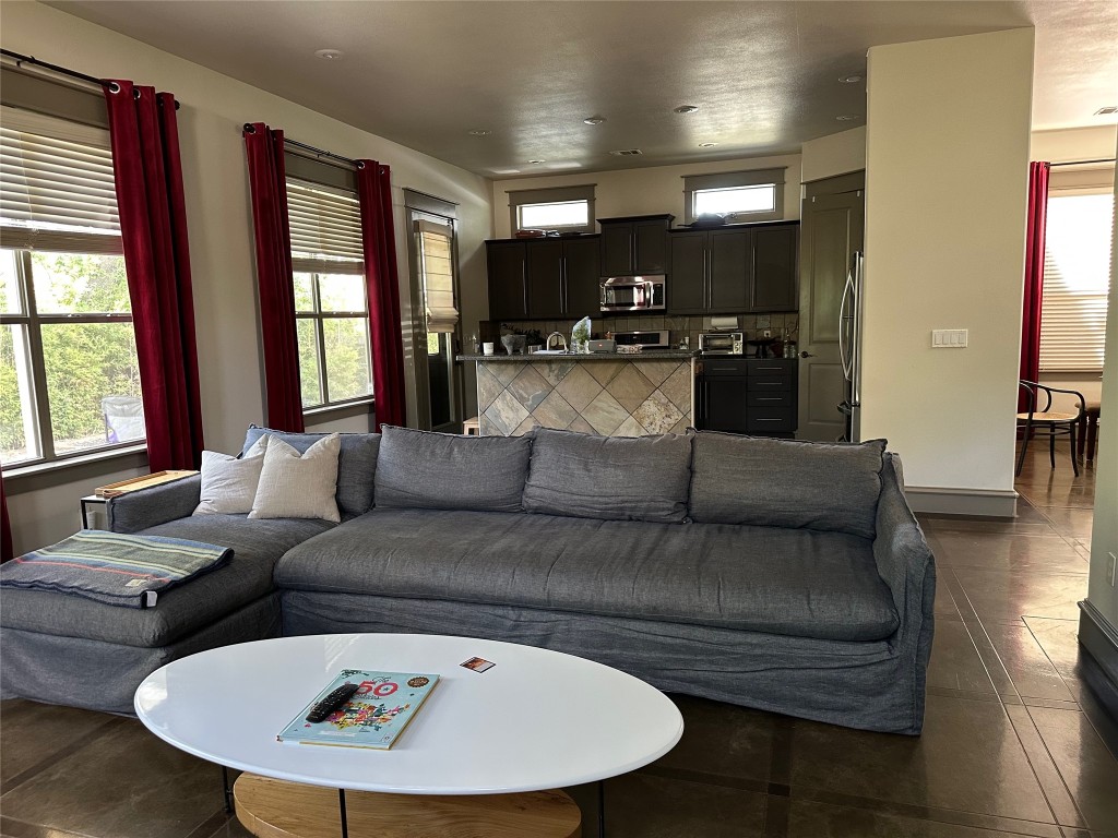 5617 Clay Avenue, Unit B Austin, TX 78756 - Photo 36 of 38 a living room with furniture kitchen and a large window