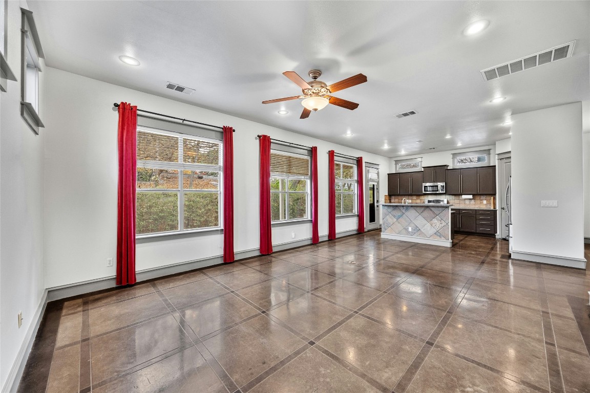 5617 Clay Avenue, Unit B Austin, TX 78756 - Photo 6 of 38 a view of an empty room with window and cabinet