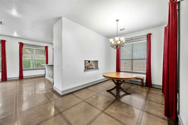 a view of a livingroom with furniture and a window