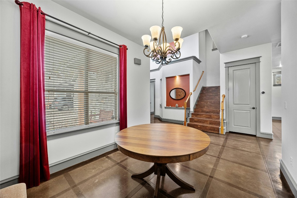 5617 Clay Avenue, Unit B Austin, TX 78756 - Photo 9 of 38 a view of a dining room with furniture and a chandelier