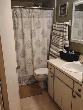 a bathroom with a sink and toilet