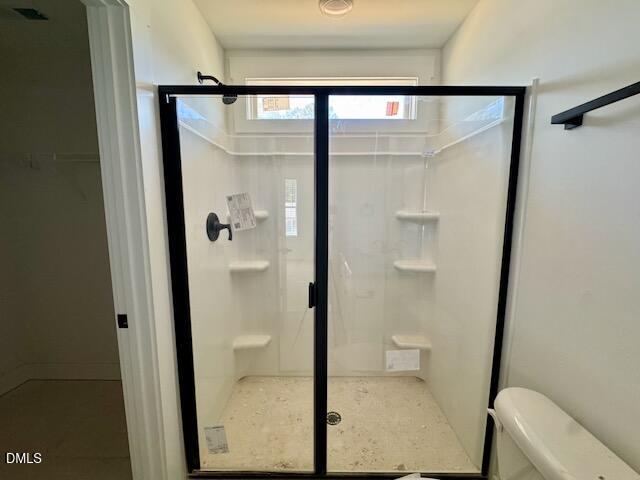 218 George Street Four Oaks, NC 27524 - Photo 34 of 50 a bathroom with a glass shower door