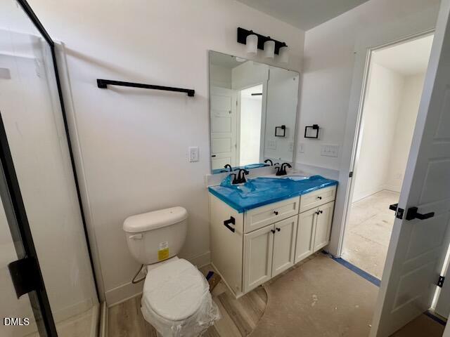 218 George Street Four Oaks, NC 27524 - Photo 36 of 50 a bathroom with a granite countertop sink toilet and shower