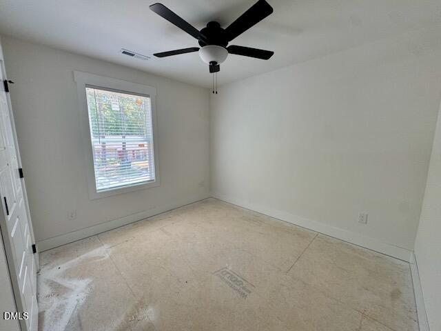 218 George Street Four Oaks, NC 27524 - Photo 46 of 50 an empty room with a window and a fan