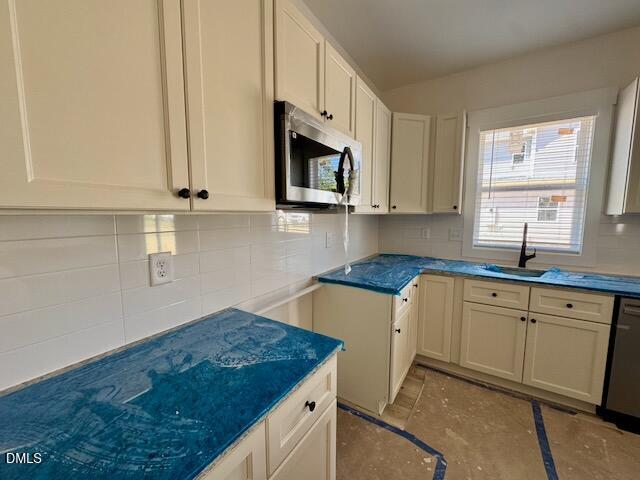 218 George Street Four Oaks, NC 27524 - Photo 8 of 50 a kitchen with stainless steel appliances granite countertop a sink stove and microwave