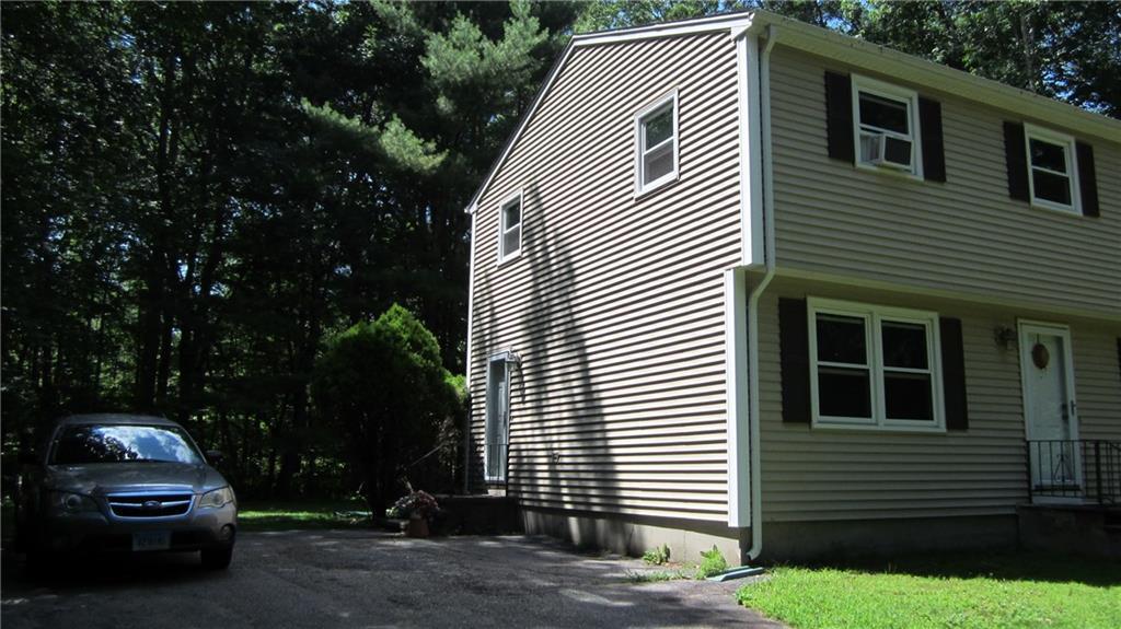 42 Hennequin Road Columbia, CT 06237 - Photo 1 of 1 a front view of a house with a yard