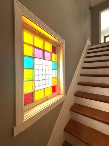 a view of an empty room with stairs