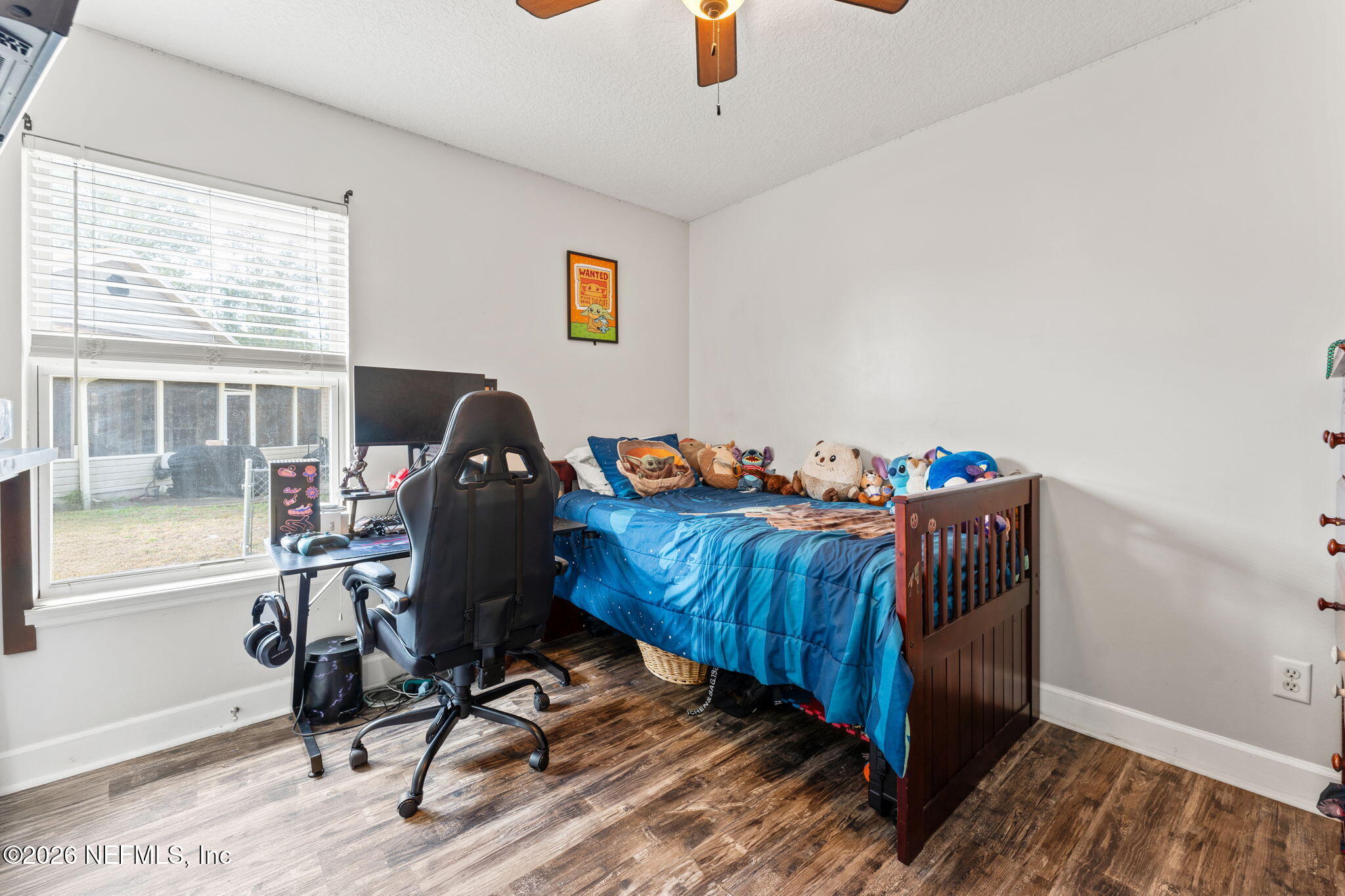 482 North 3rd Street Macclenny, FL 32063 - Photo 19 of 32 a view of a workspace with furniture and a window