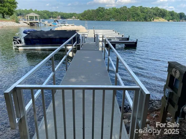 a balcony view with two chairs