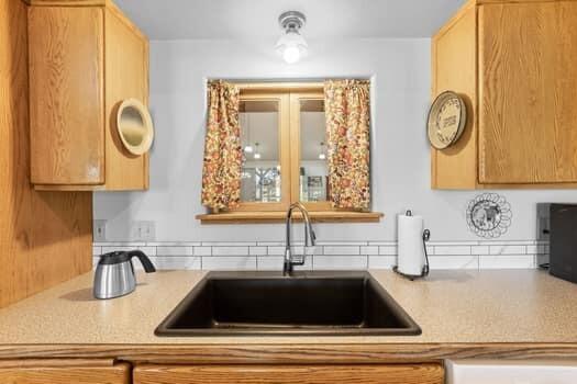 61538 Ward Road Bend, OR 97702 - Photo 16 of 42 Kitchen sink with viewing pass through to Living Room