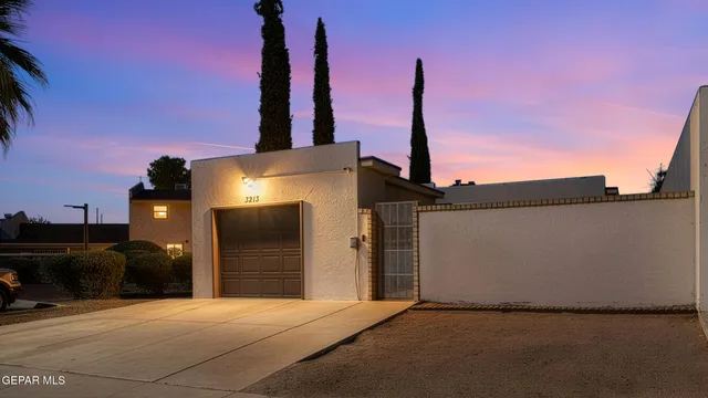 a front view of a building with parking space