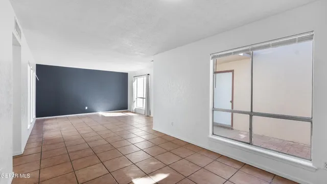 a view of a hallway with closet and bathroom