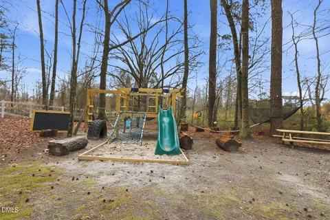 an aerial view of a house with yard
