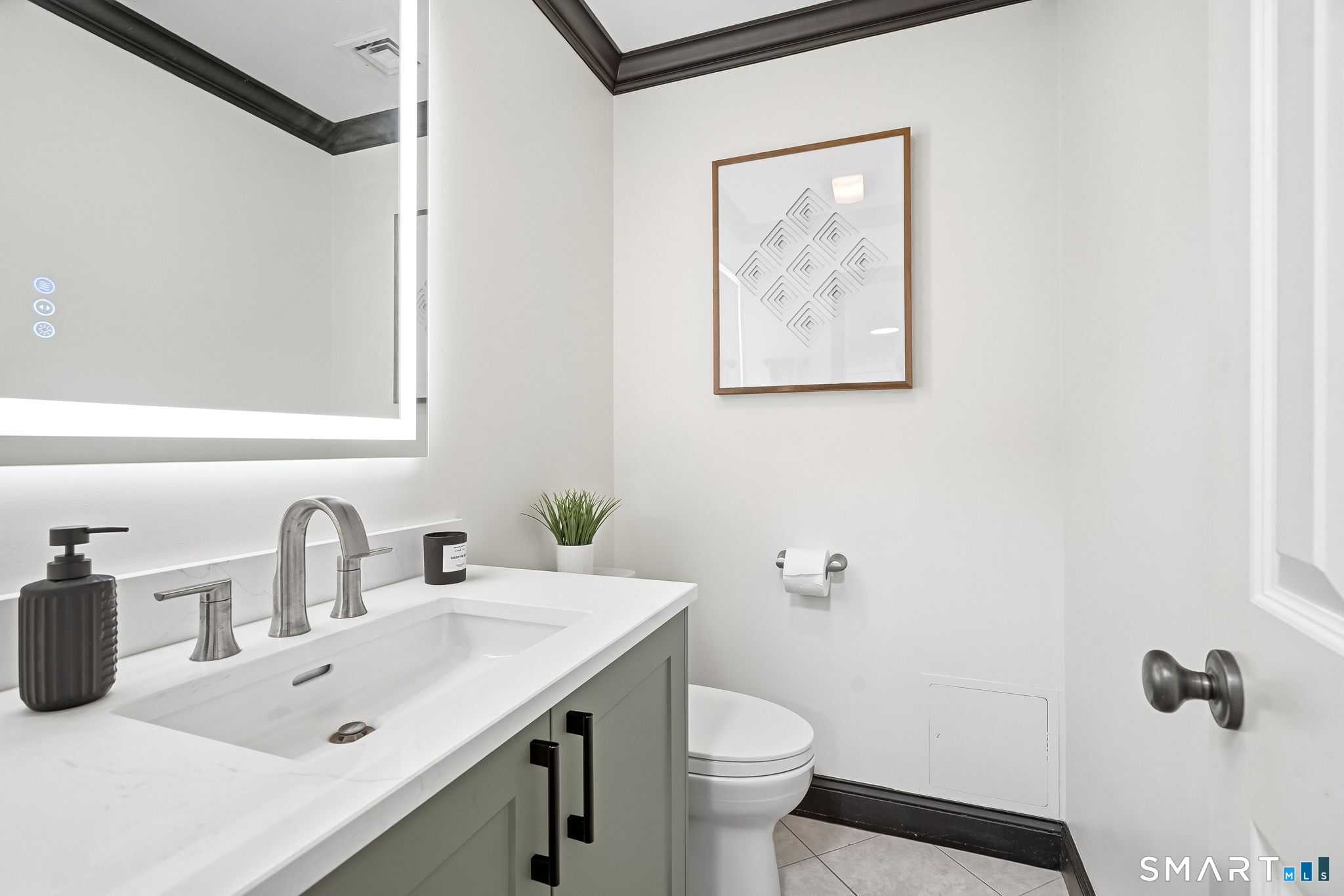 80 3rd Avenue Stratford, CT 06615 - Photo 20 of 40 a bathroom with a sink mirror vanity and toilet
