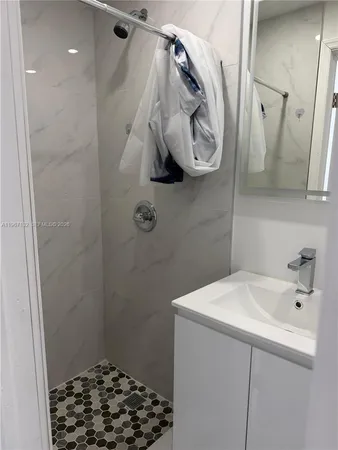a bathroom with a sink and a mirror