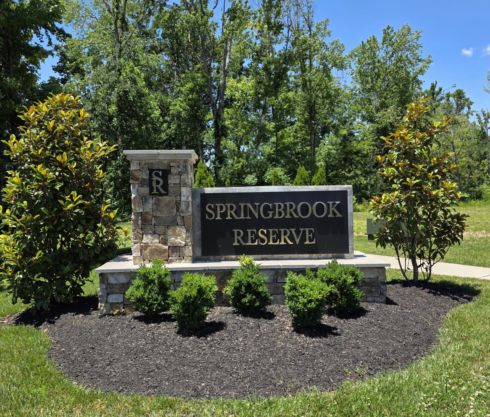 369 Springbrook Boulevard White House, TN 37188 - Photo 18 of 30 a sign that is sitting in front of flowers