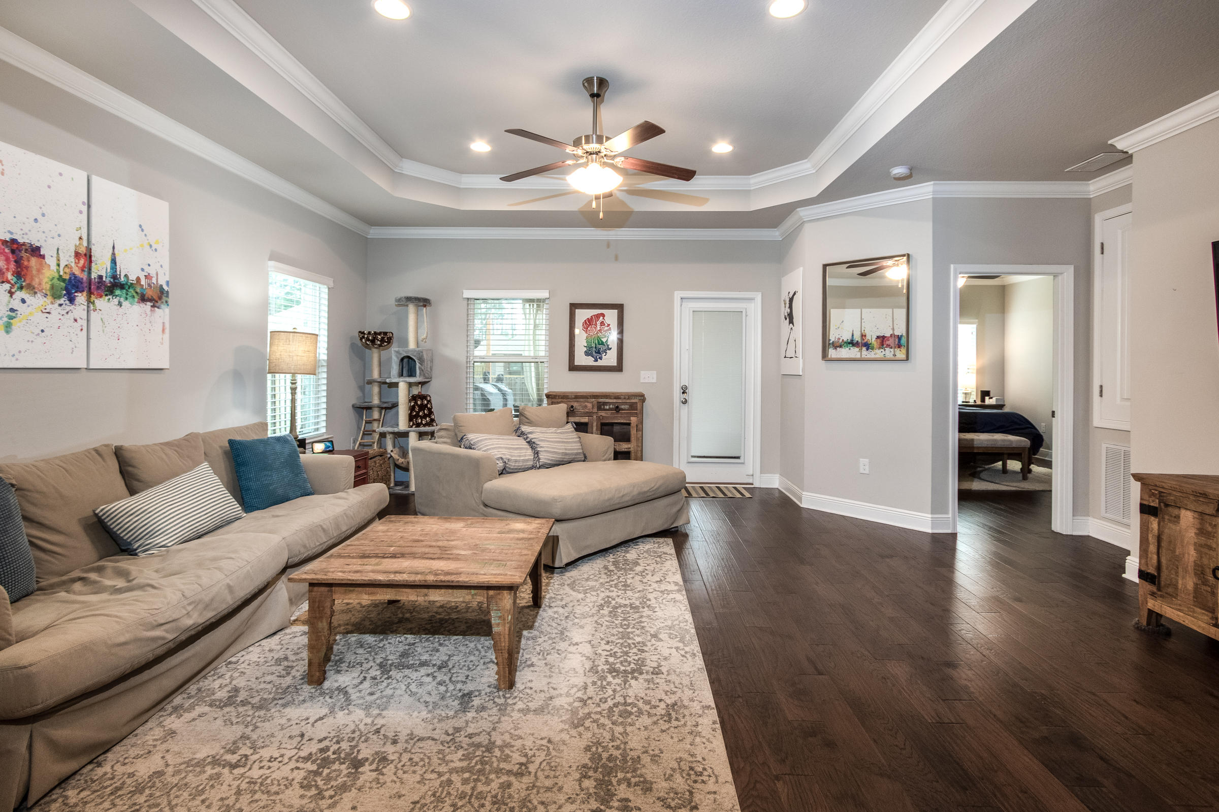196 Pin Oak Loop Santa Rosa Beach, FL 32459 - Photo 11 of 34 a living room with furniture and a wooden floor