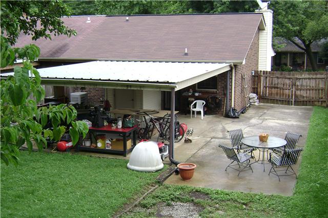 790 Fitzpatrick Road Nashville, TN 37214 - Photo 4 of 20 Back View of Patio, 2 Car Carport w/ Storage Room! The Carport is Currently Being Used for a WORKSHOP Area! BONUS #1: The Patio Set Will Remain!