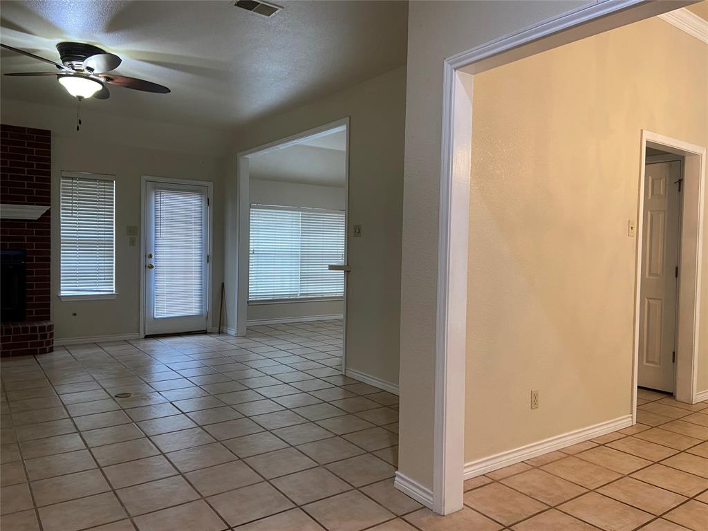 1102 North Main Street Leonard, TX 75452 - Photo 2 of 25 a view of a hallway with closet and a chandelier fan