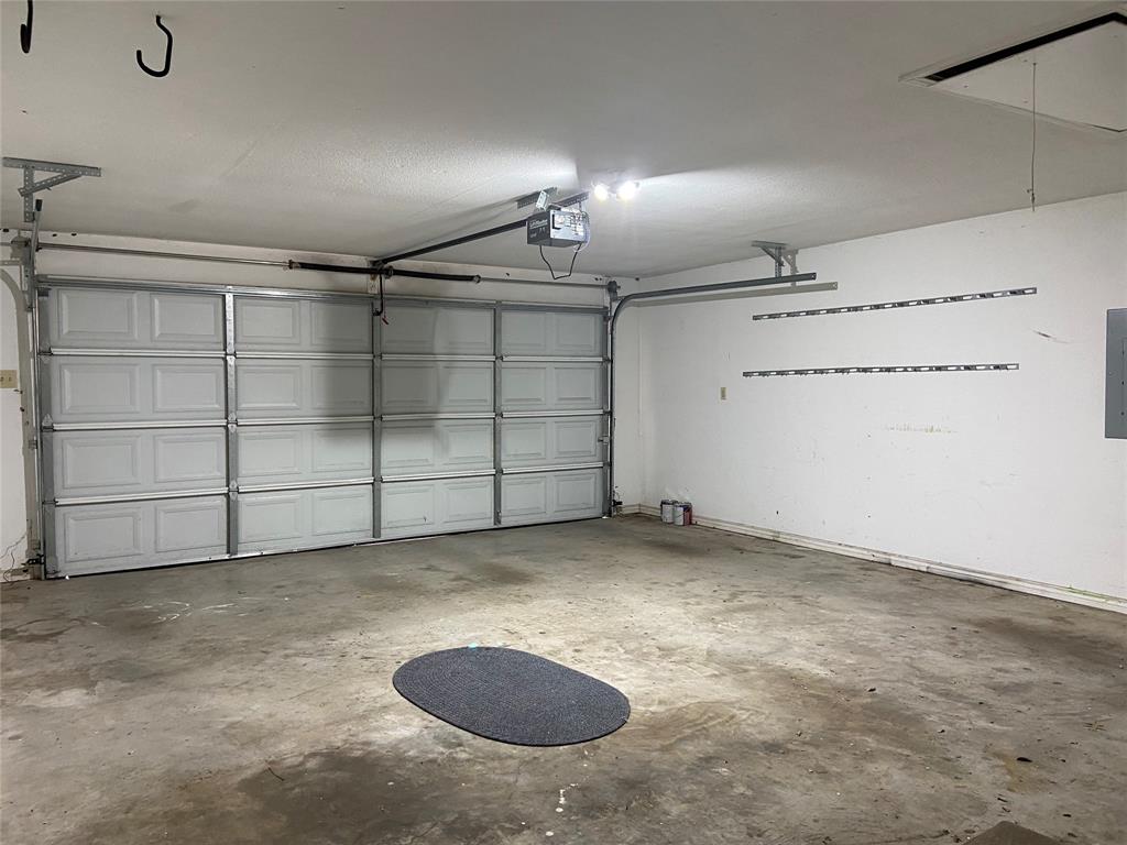1102 North Main Street Leonard, TX 75452 - Photo 22 of 25 an empty room with a cabinet and mirrors