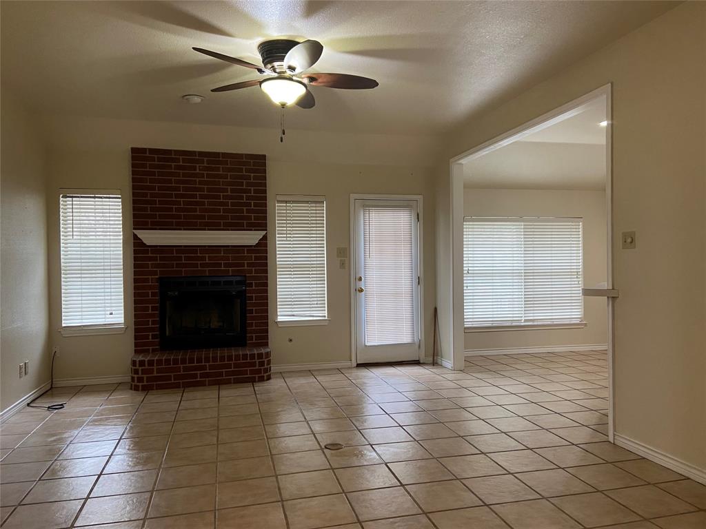 1102 North Main Street Leonard, TX 75452 - Photo 3 of 25 a view of an empty room with window and fireplace