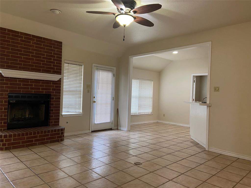 1102 North Main Street Leonard, TX 75452 - Photo 4 of 25 a view of empty room with wooden floor and fan