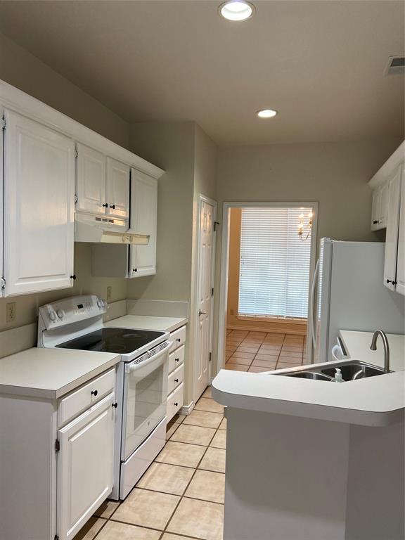 1102 North Main Street Leonard, TX 75452 - Photo 8 of 25 a kitchen that has a sink and a stove