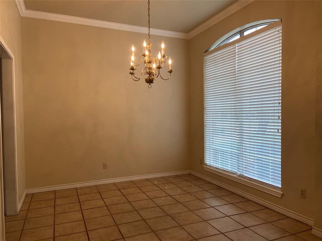 1102 North Main Street Leonard, TX 75452 - Photo 9 of 25 a view of a livingroom with a chandelier fan and window