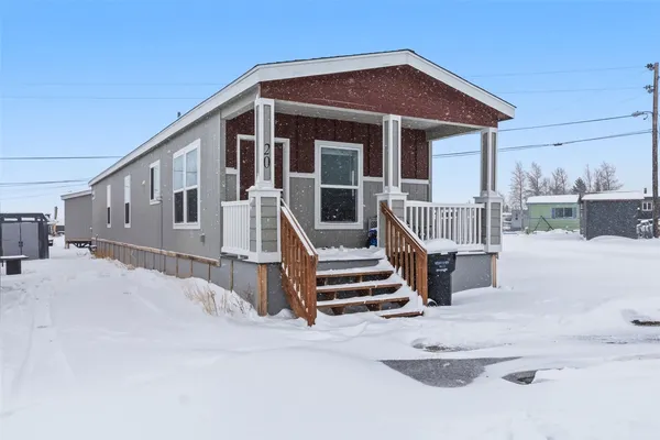 a view of roof deck with a table and chairs