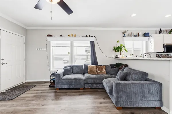 a living room with furniture and a window