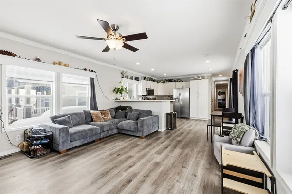 a living room with furniture and a large window