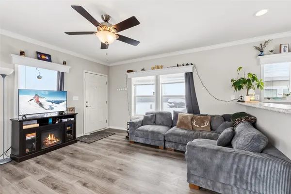 a living room with furniture and a fireplace