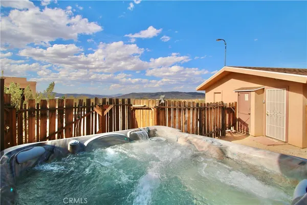 a view of swimming pool of water with lots of trees