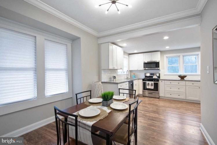 14 Sewell Street Glassboro, NJ 08028 - Photo 11 of 15 a view of kitchen with cabinets and wooden floor