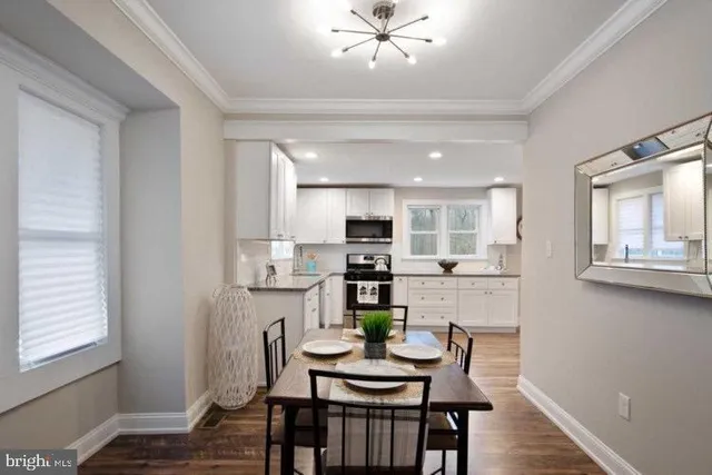 a view of a livingroom with furniture wooden floor and a table