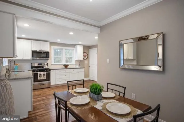 a view of kitchen with cabinets and wooden floor