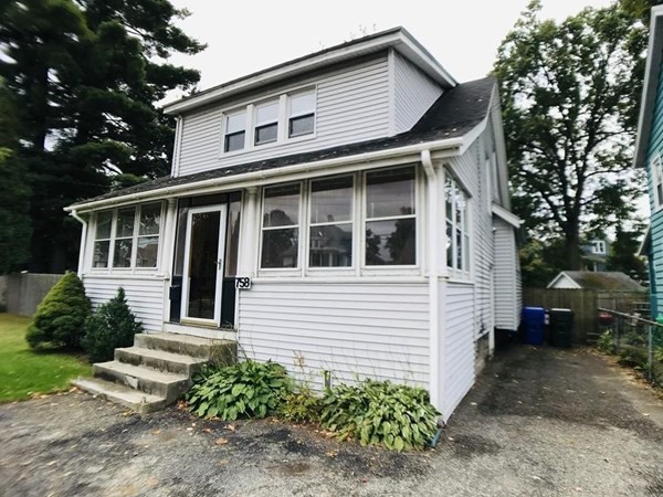 758 White Street Springfield, MA 01108 - Photo 1 of 1 a view of a white house with a small yard and large trees