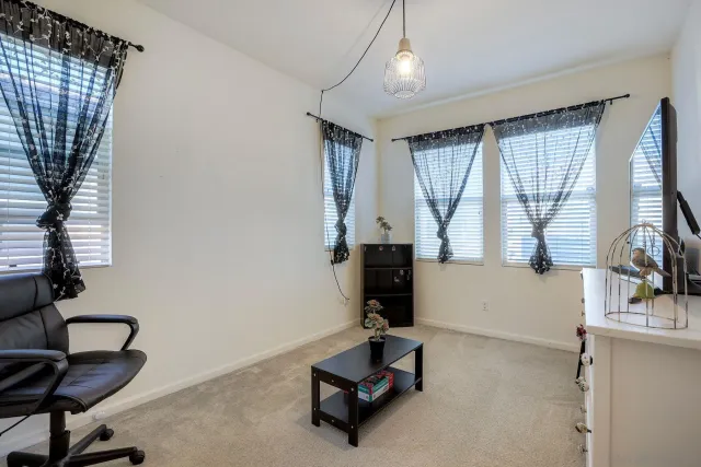 a room with gym equipment and a large window