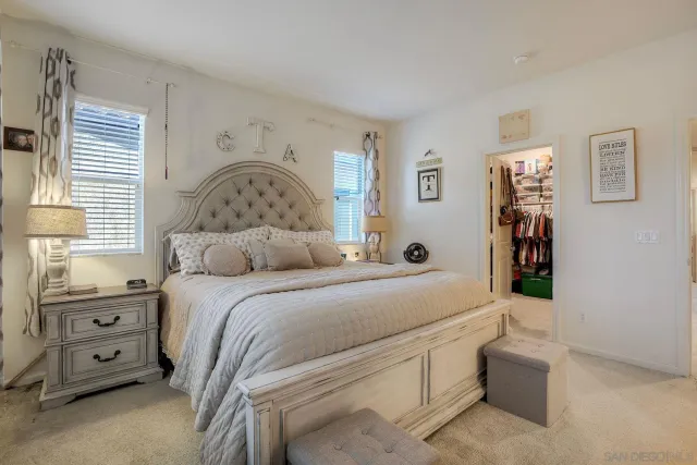 a bedroom with a bed and a view of bedroom