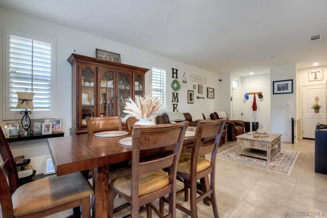 a view of a dining room with furniture and window